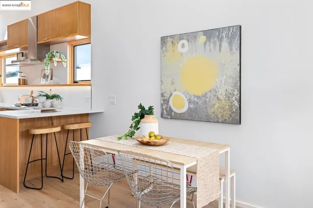 a living room with patio furniture and a potted plant