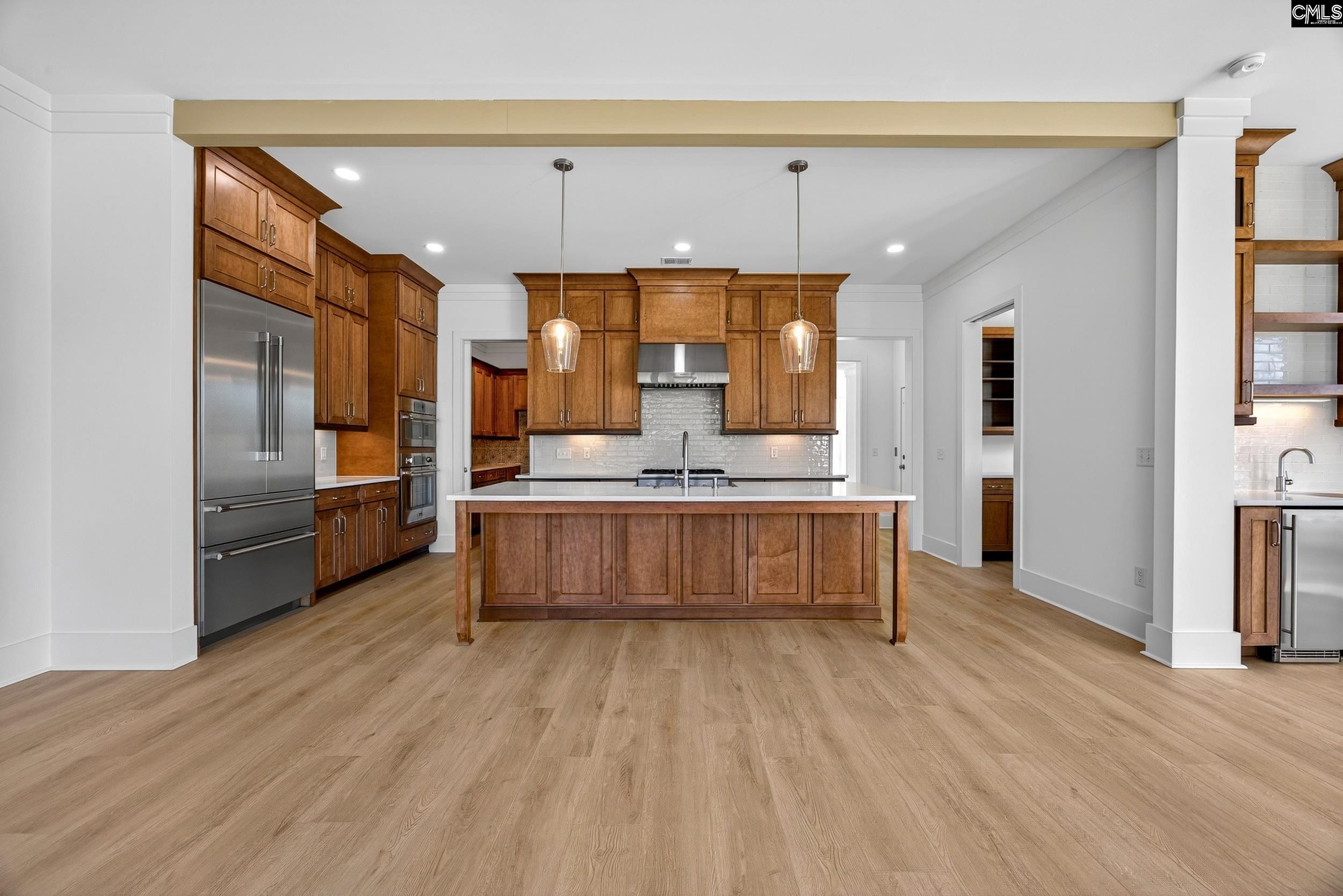 1318 Long Grove Way Lexington, SC 29072 - Photo 15 of 90 a large kitchen with a large window and stainless steel appliances
