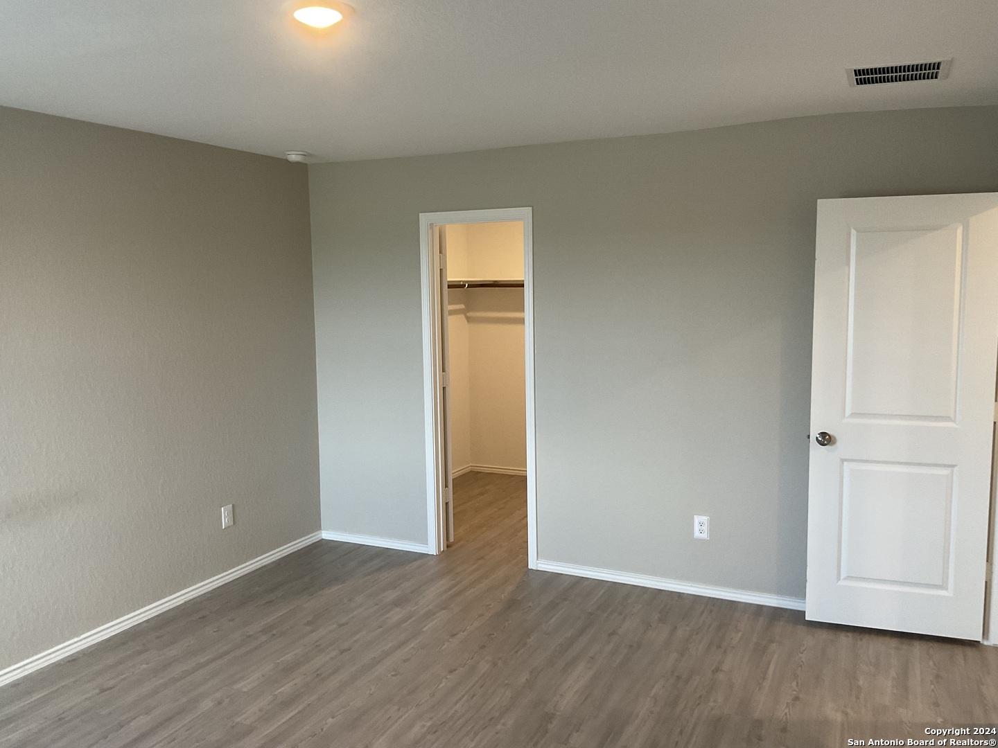 5813 Companion Loop Bulverde, TX 78163 - Photo 11 of 28 an empty room with wooden floor and closet