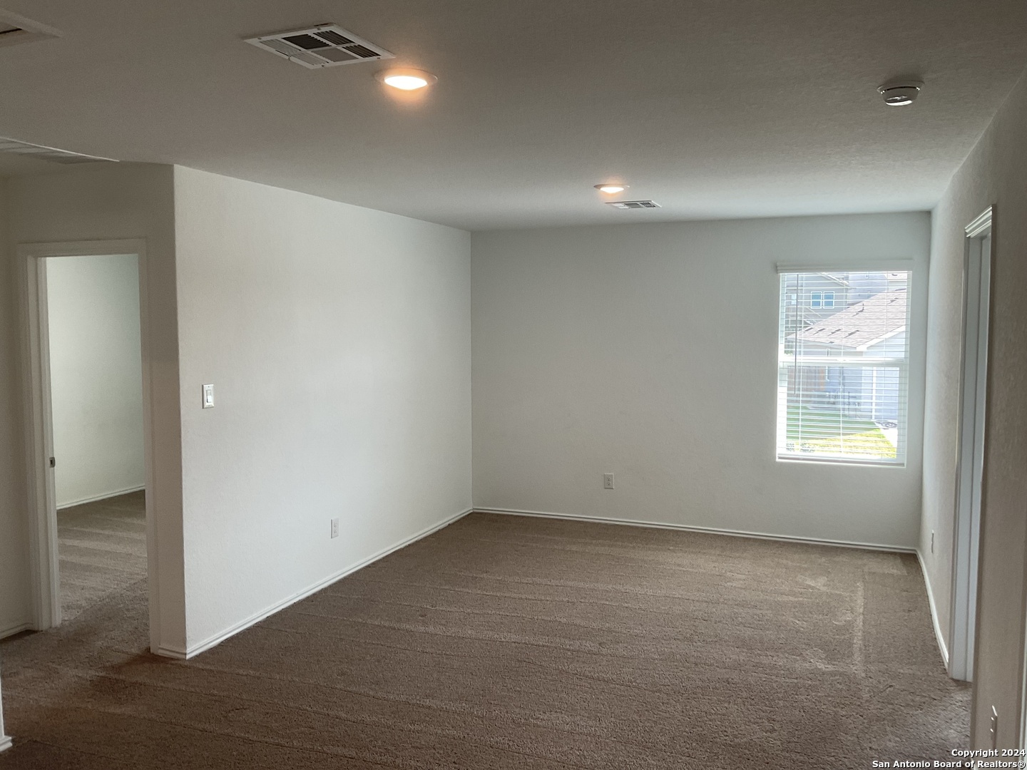 5813 Companion Loop Bulverde, TX 78163 - Photo 16 of 28 an empty room with windows