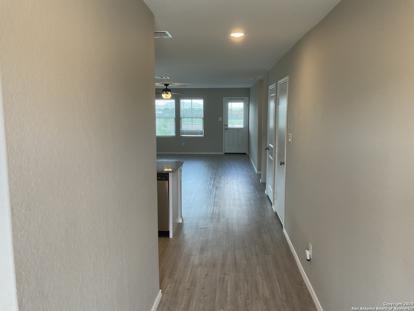 5813 Companion Loop Bulverde, TX 78163 - Photo 2 of 28 a view of hallway with wooden floor