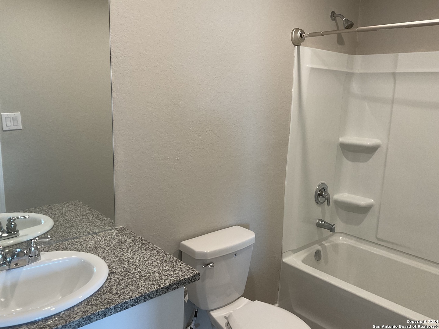 5813 Companion Loop Bulverde, TX 78163 - Photo 21 of 28 a bathroom with a granite countertop sink toilet and shower