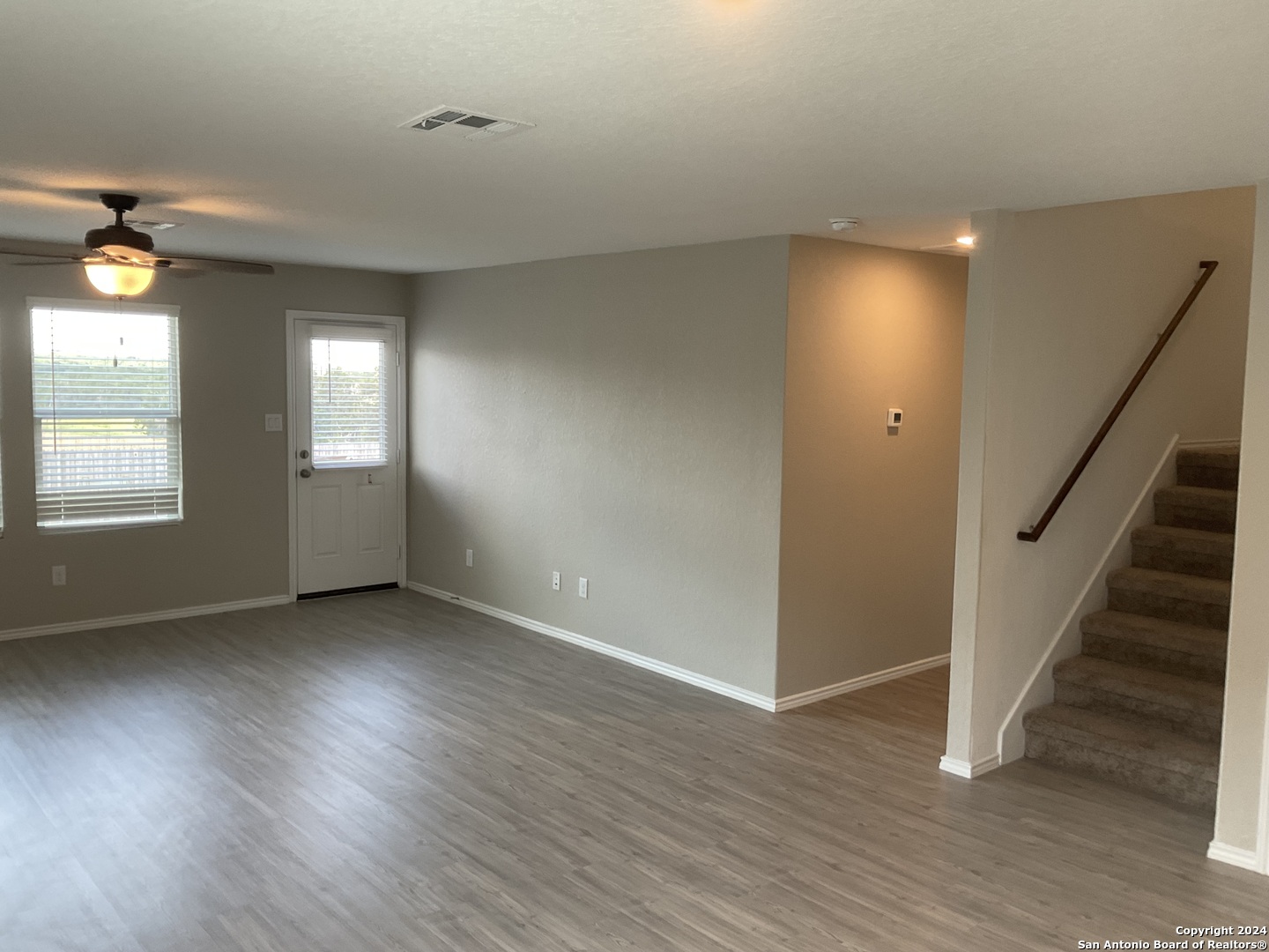 5813 Companion Loop Bulverde, TX 78163 - Photo 8 of 28 wooden floor in an empty room with a window