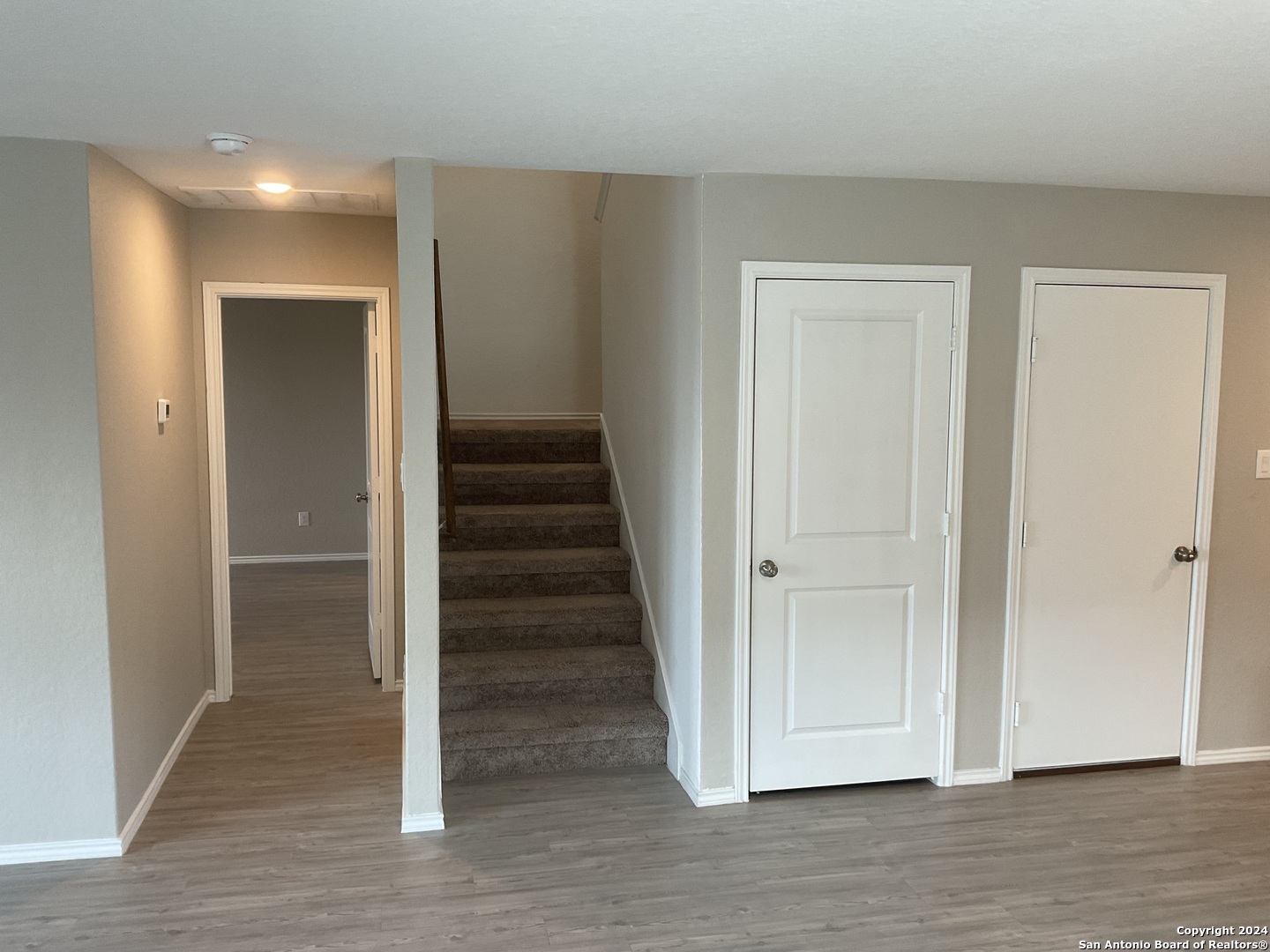 5813 Companion Loop Bulverde, TX 78163 - Photo 9 of 28 a view of a hallway with wooden floor and entryway