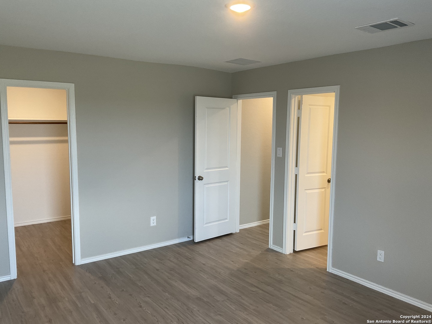 5813 Companion Loop Bulverde, TX 78163 - Photo 10 of 28 an empty room with wooden floor and windows