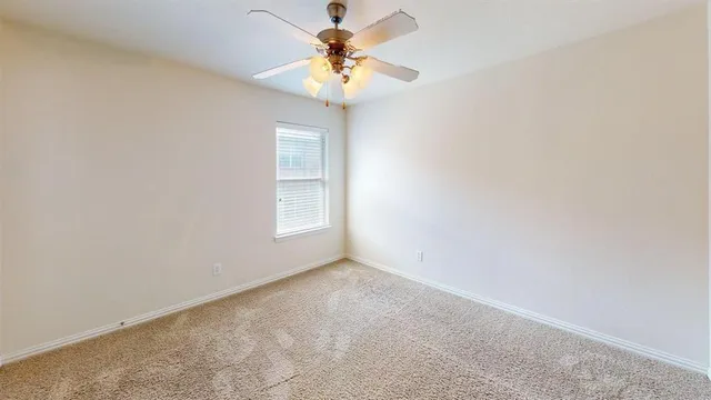 a view of a chandelier fan in a room