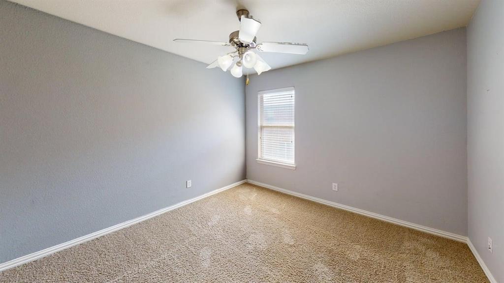 392 Dublin Street Lewisville, TX 75067 - Photo 14 of 21 an empty room with windows and chandelier fan