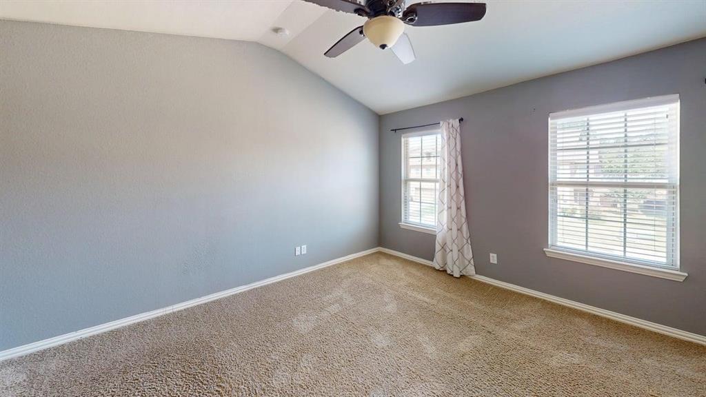 392 Dublin Street Lewisville, TX 75067 - Photo 9 of 21 an empty room with a window and ceiling fan