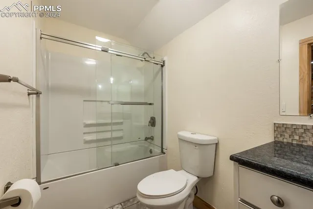 a view of balcony with wooden floor and fence