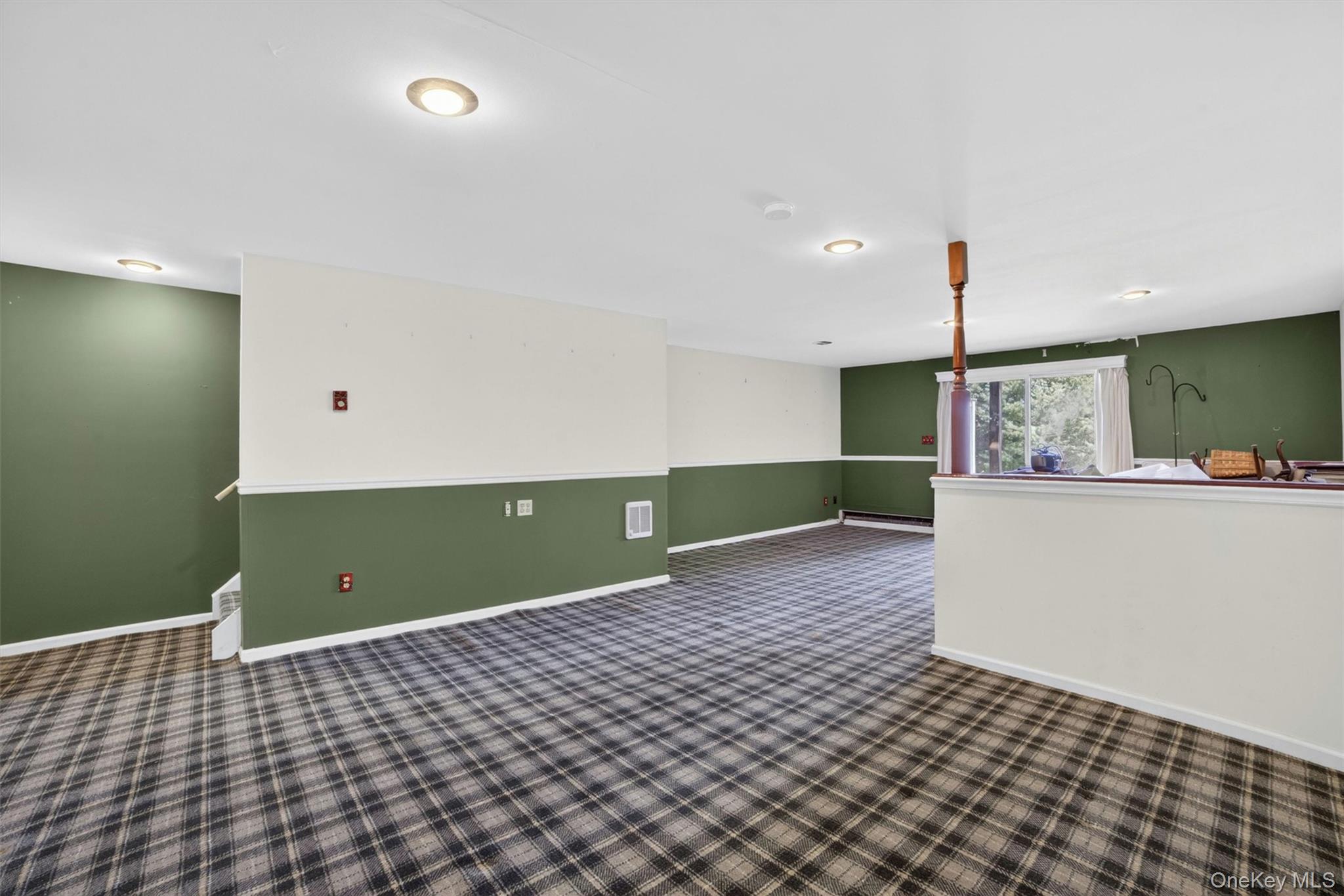 116 Fields Lane Peekskill, NY 10566 - Photo 26 of 40 a view of a room with kitchen island stainless steel appliances wooden floor and windows