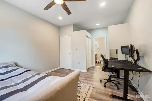 a bedroom with a workspace