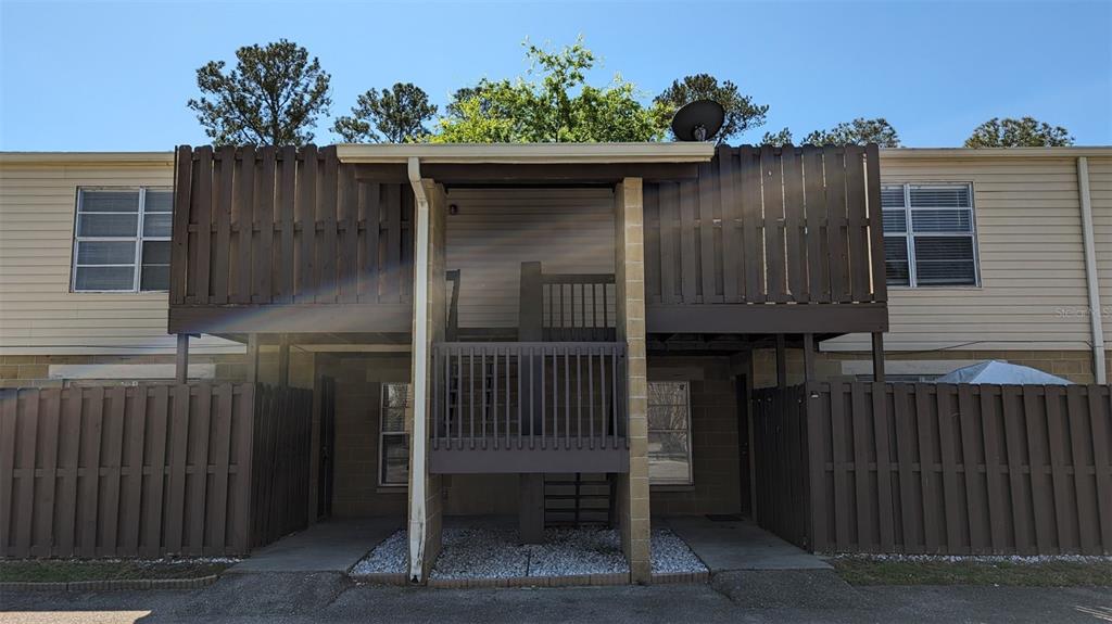 a side view of a house with a balcony