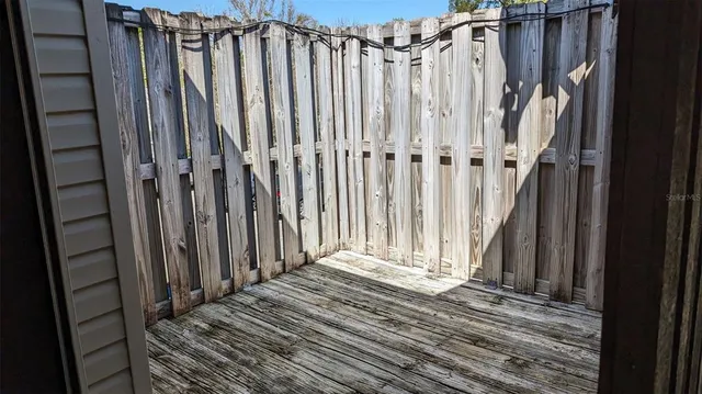 a view of a wooden door with a window