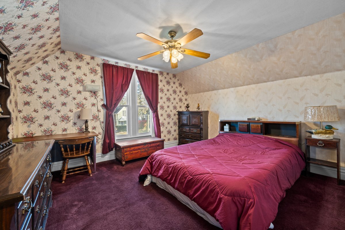 644 Oak Avenue Aurora, IL 60506 - Photo 14 of 21 a bed room with a bed and a window