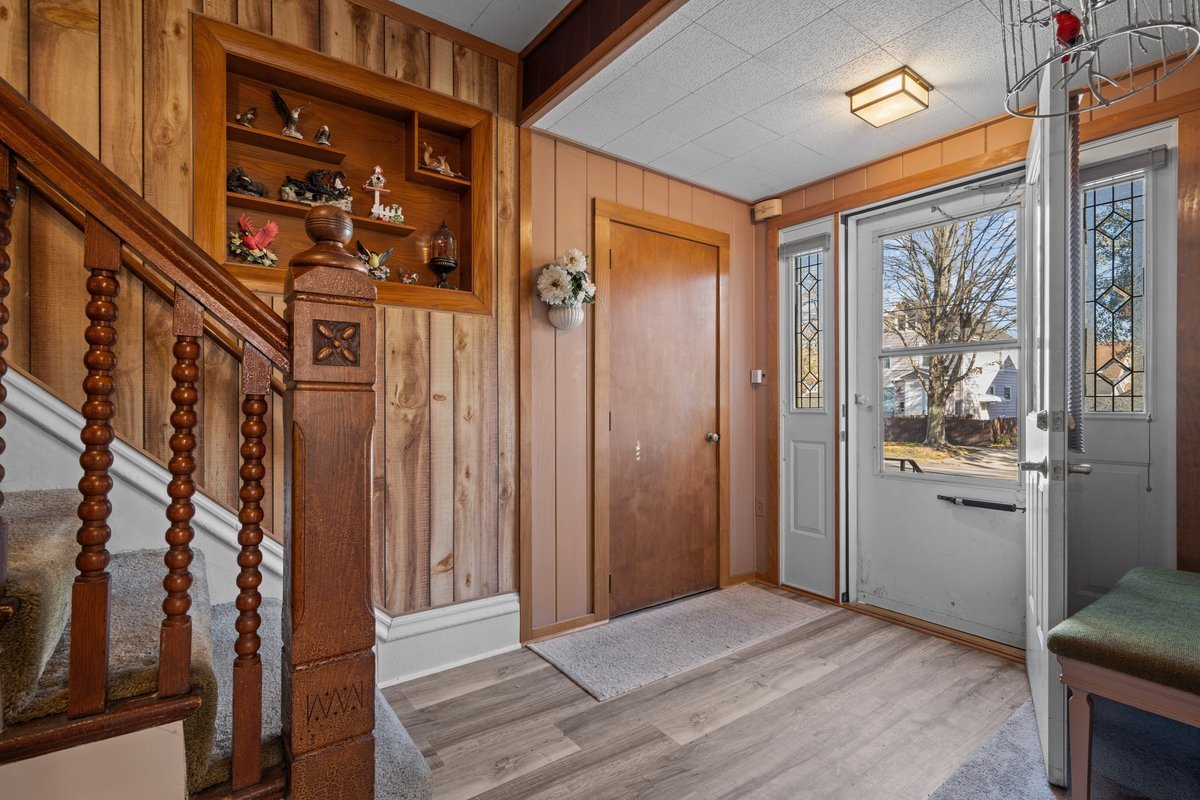 644 Oak Avenue Aurora, IL 60506 - Photo 3 of 21 a view of a hallway with a door and wooden floor