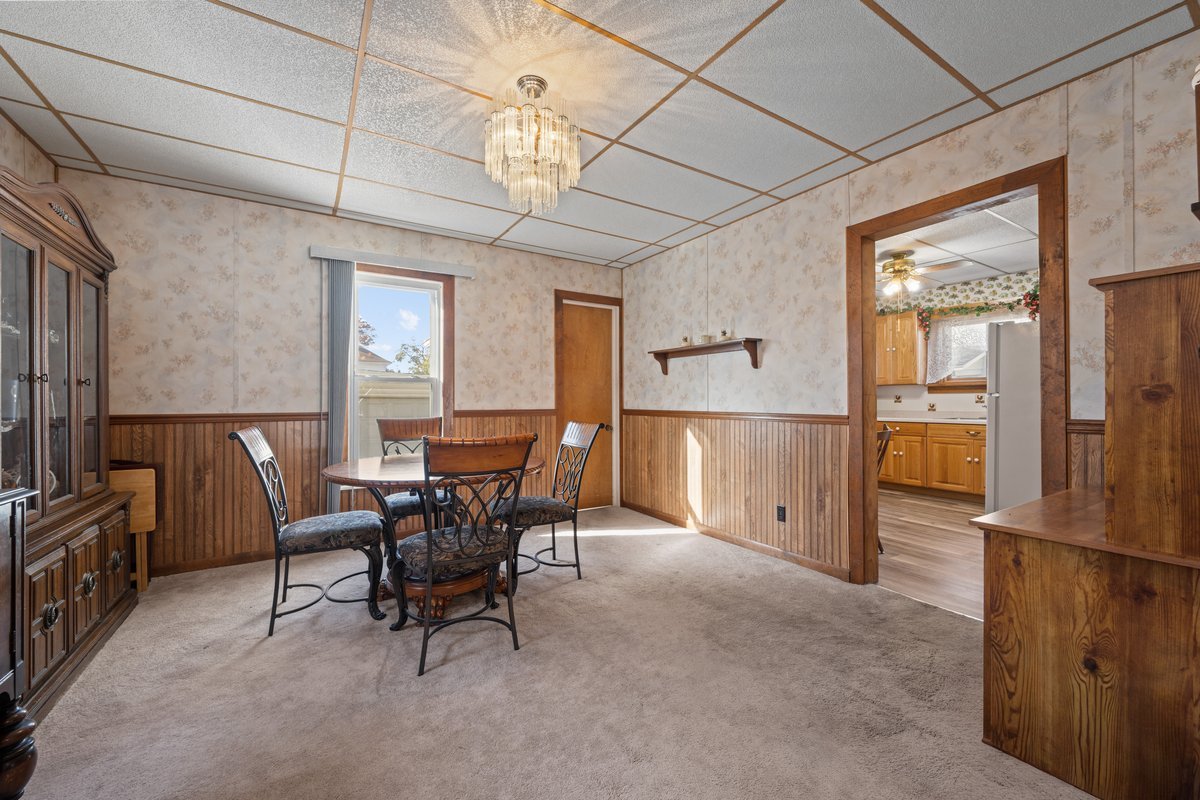 644 Oak Avenue Aurora, IL 60506 - Photo 7 of 21 a view of a dining room with furniture window and wooden floor