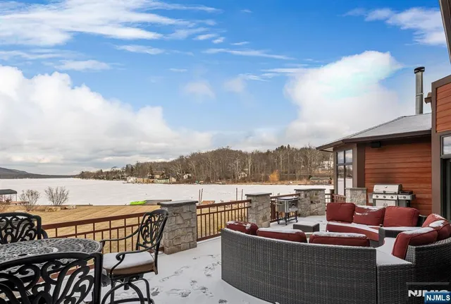 a view of a balcony with table and chairs
