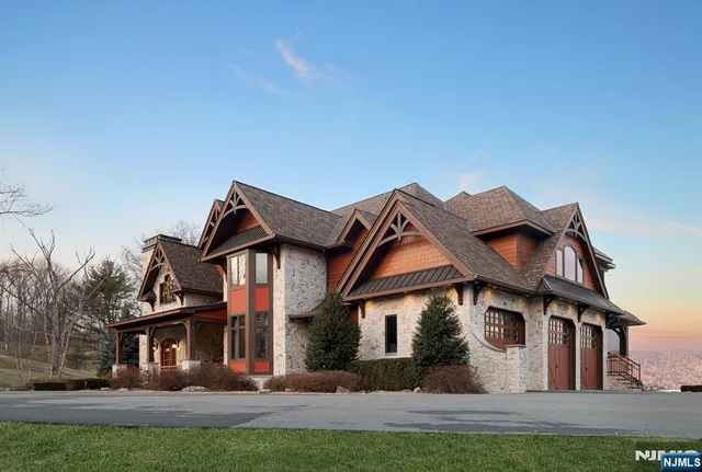a front view of a house with a road