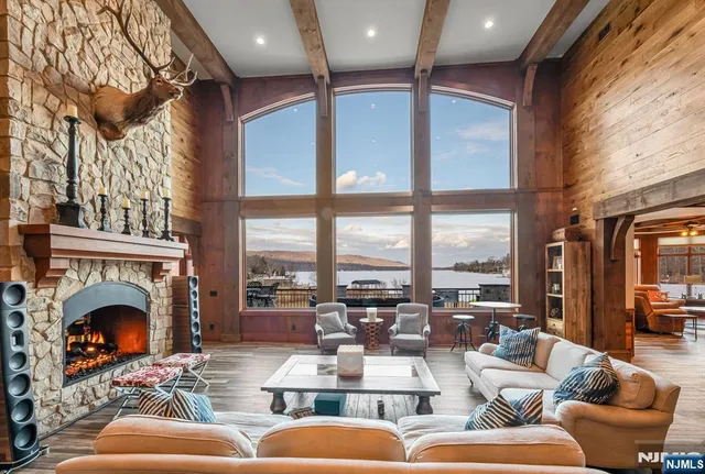 a living room with fireplace furniture and a fireplace