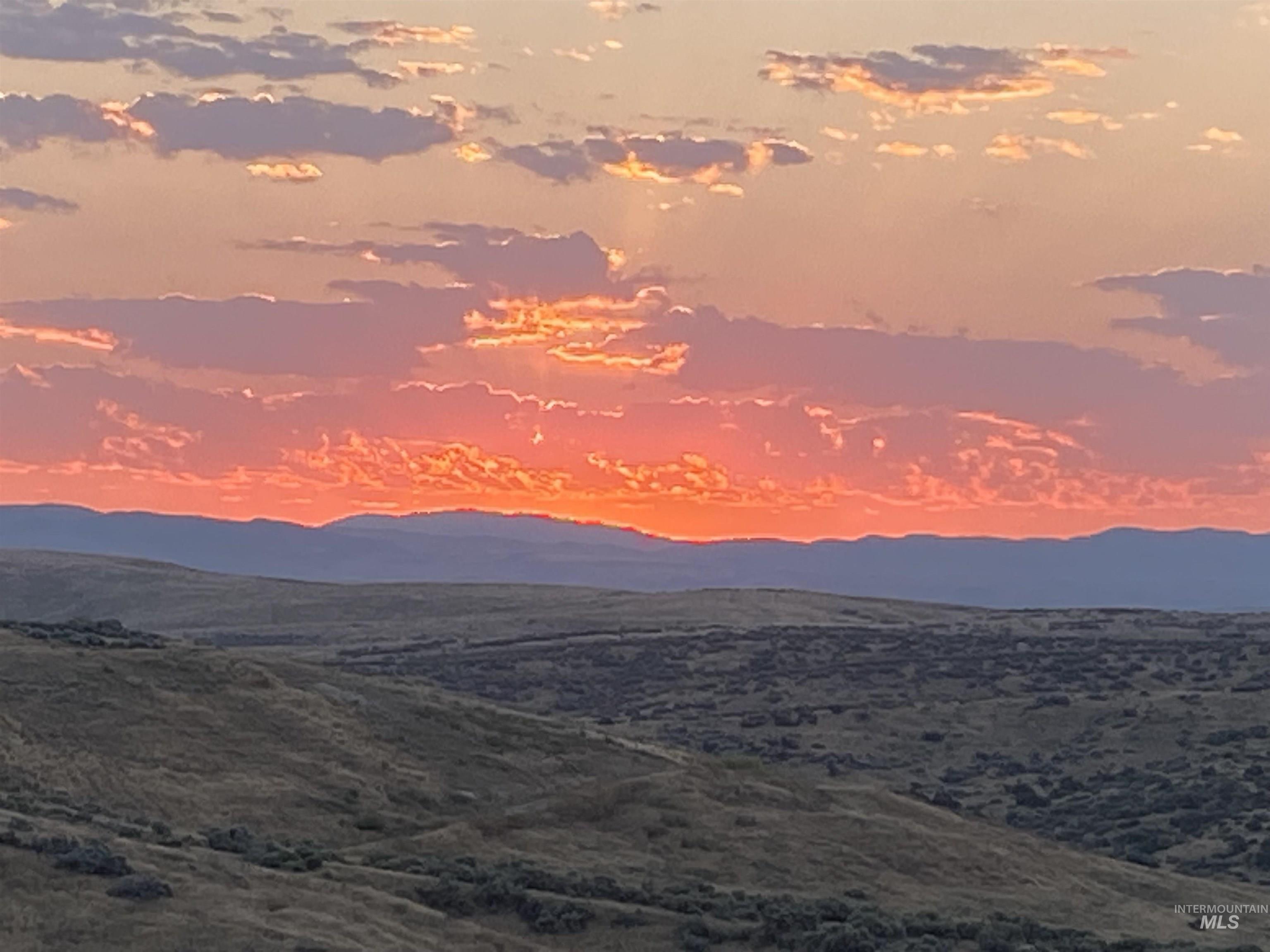 5660 North Star Ridge Way Star, ID 83669 - Photo 47 of 47 Expansive natural landscape under a vibrant sunset sky