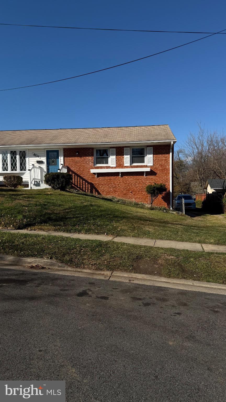 8314 Nicholson Street Hyattsville, MD 20784 - Photo 3 of 3 a front view of a house with a yard