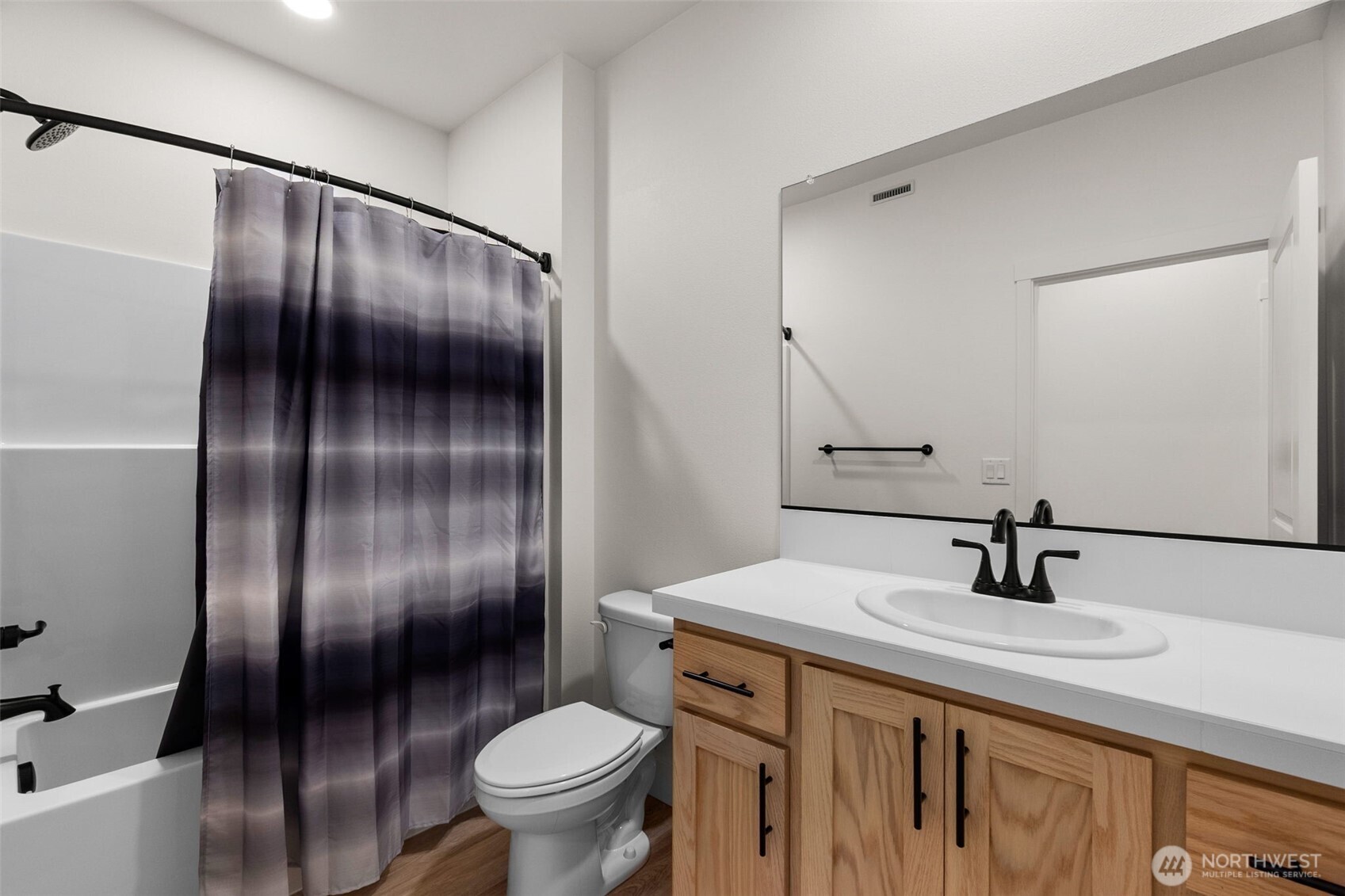 504 Pagget Avenue Winlock, WA 98596 - Photo 14 of 27 a bathroom with a sink and a mirror
