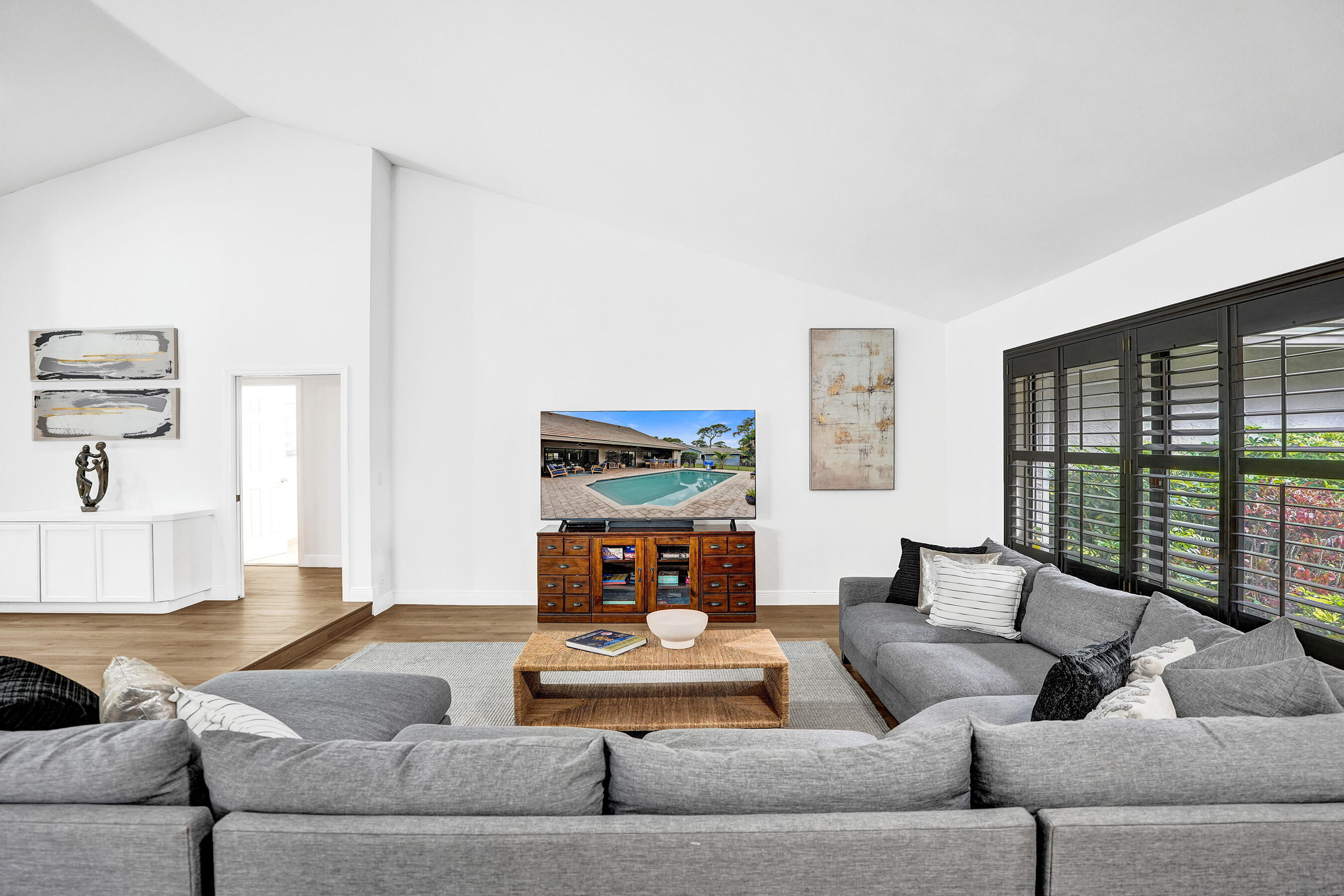 2413 Northwest 40th Circle Boca Raton, FL 33431 - Photo 11 of 66 a living room with furniture and a large window