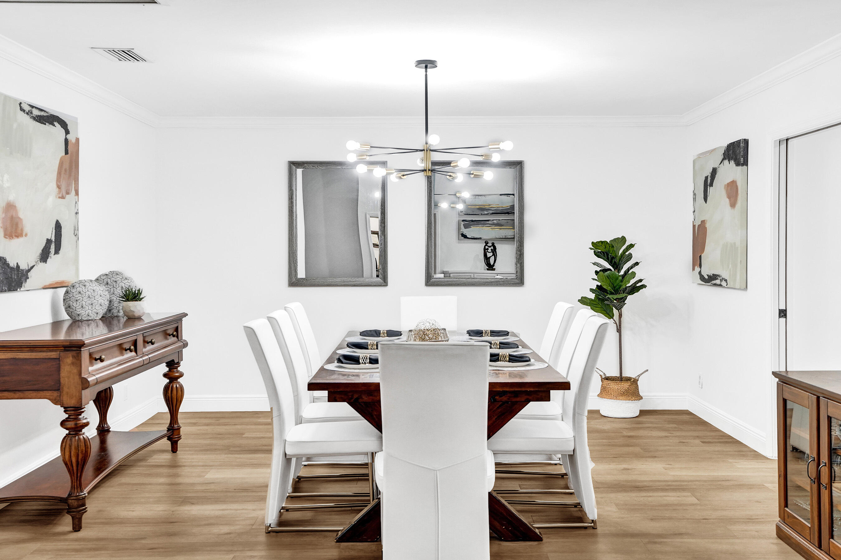 2413 Northwest 40th Circle Boca Raton, FL 33431 - Photo 13 of 66 a view of a dining room with furniture and wooden floor