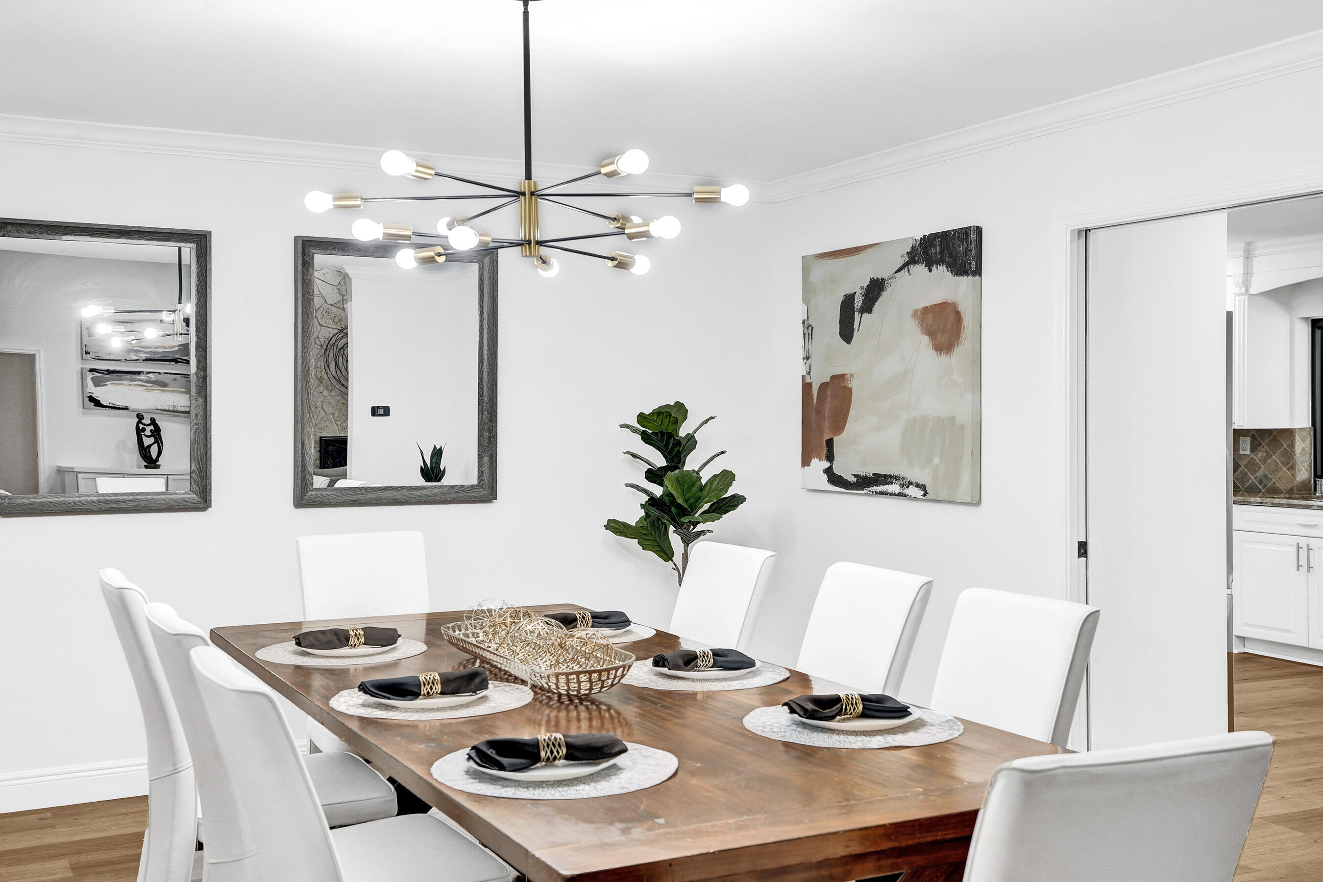 2413 Northwest 40th Circle Boca Raton, FL 33431 - Photo 14 of 66 a view of a dining room with furniture and wooden floor