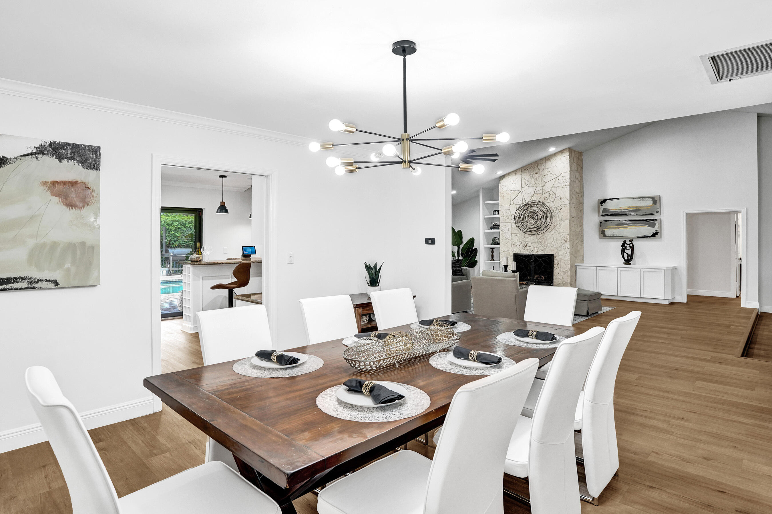 2413 Northwest 40th Circle Boca Raton, FL 33431 - Photo 15 of 66 a view of a dining room with furniture and wooden floor