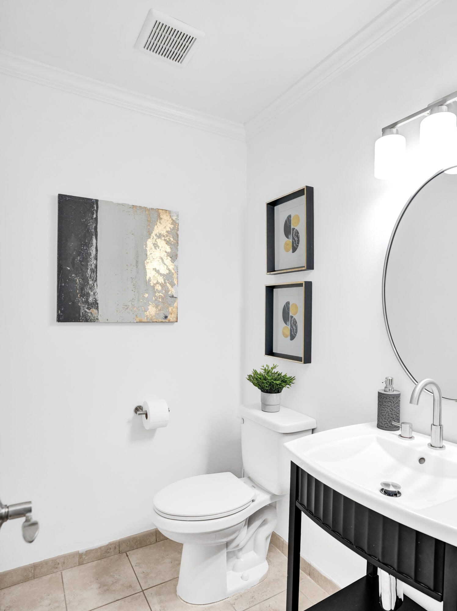 2413 Northwest 40th Circle Boca Raton, FL 33431 - Photo 16 of 66 a bathroom with a toilet a sink and mirror