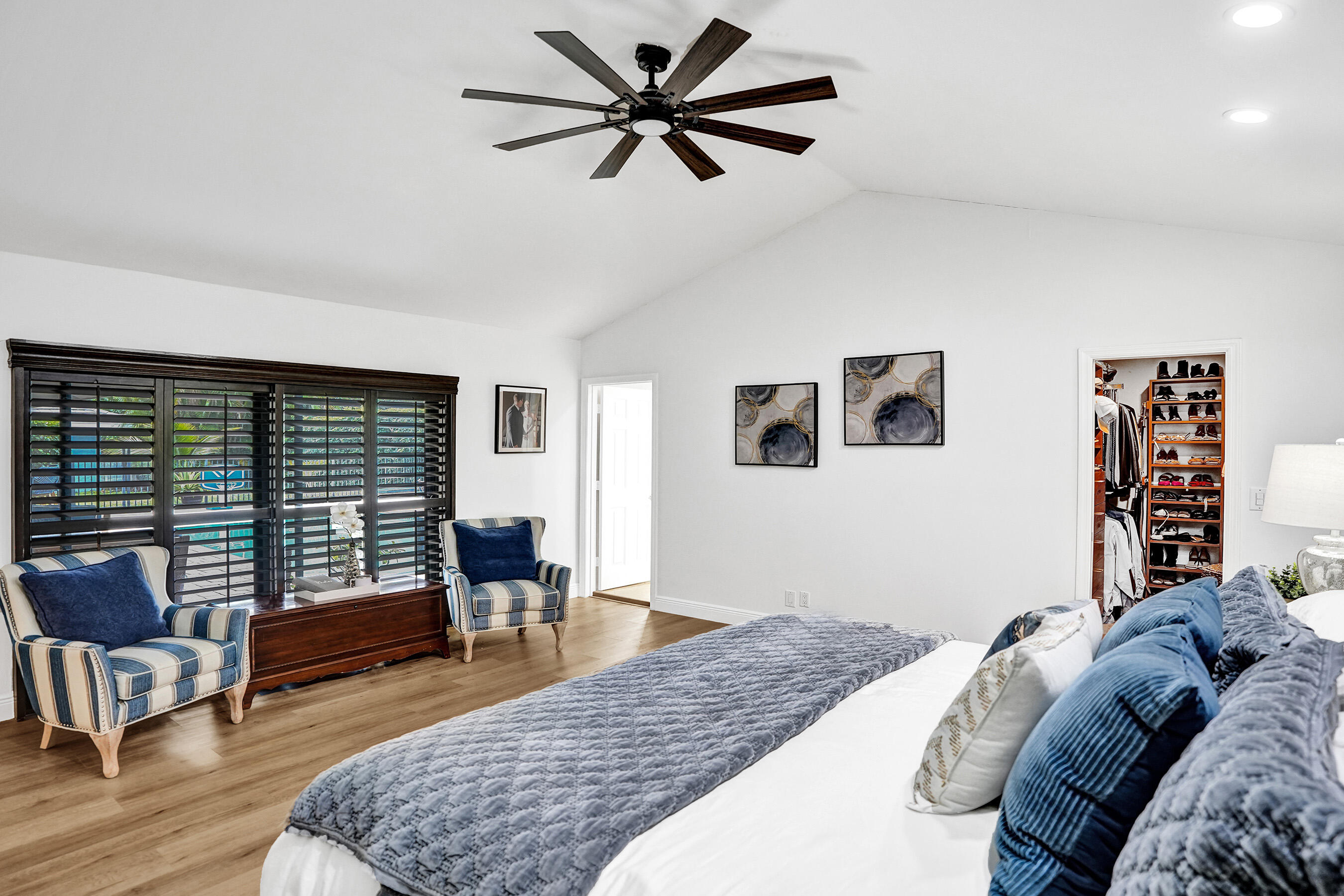 2413 Northwest 40th Circle Boca Raton, FL 33431 - Photo 27 of 66 a bedroom with a bed and wooden floor