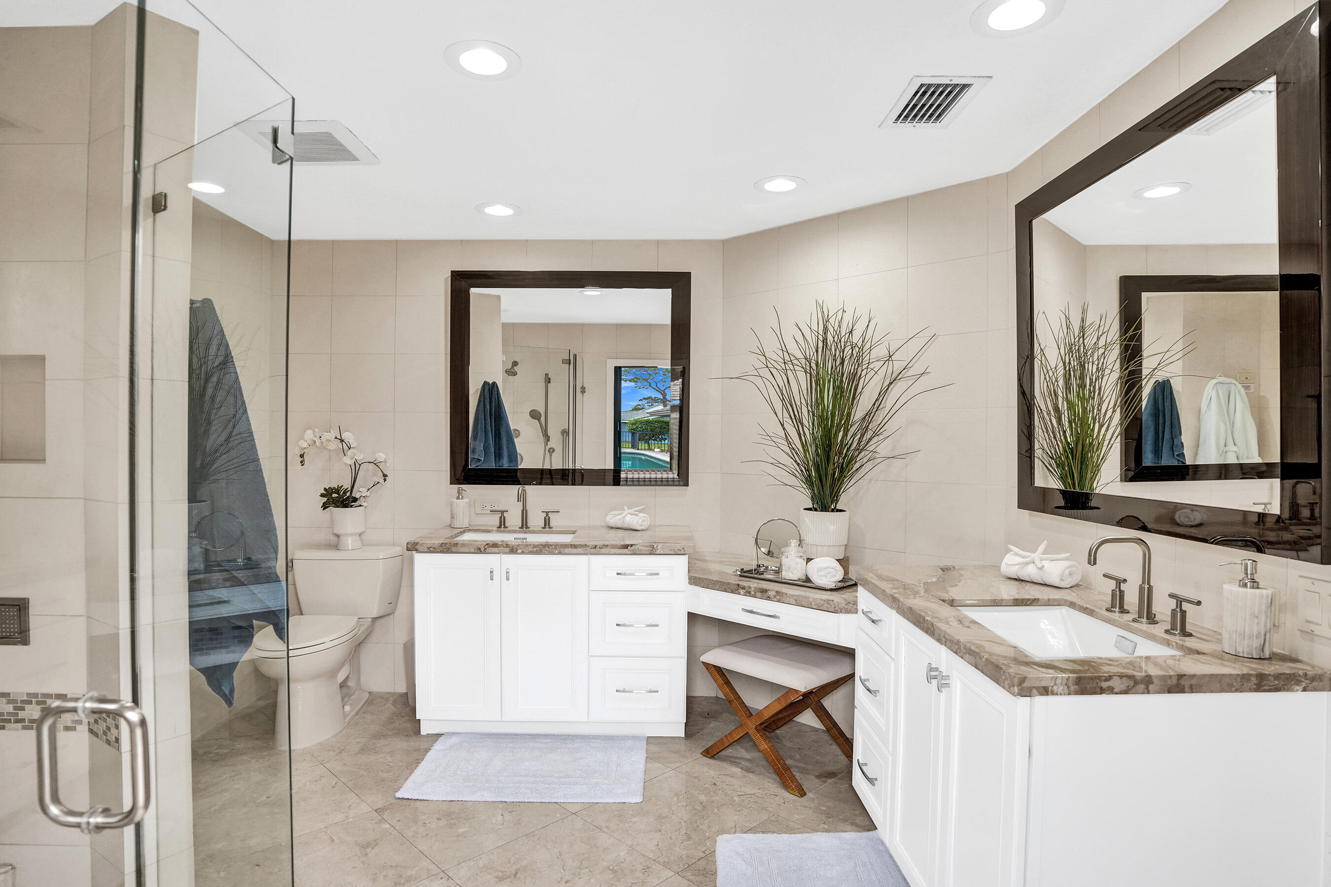 2413 Northwest 40th Circle Boca Raton, FL 33431 - Photo 29 of 66 a bathroom with a granite countertop sink a toilet and mirror