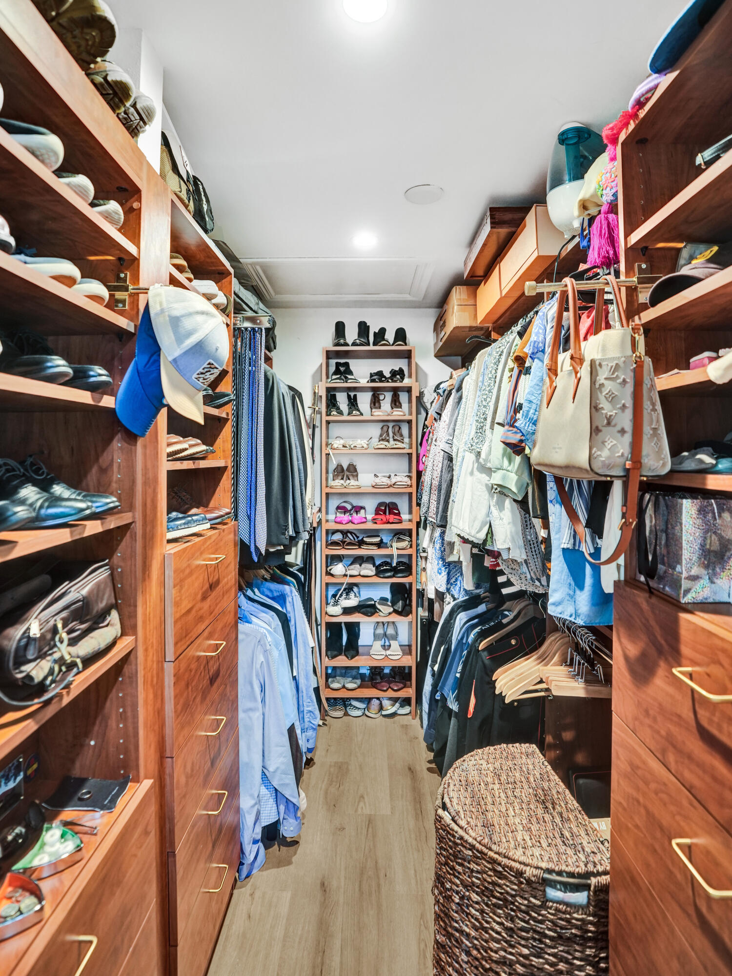 2413 Northwest 40th Circle Boca Raton, FL 33431 - Photo 31 of 66 a view of walk in closet with clothes and shoes