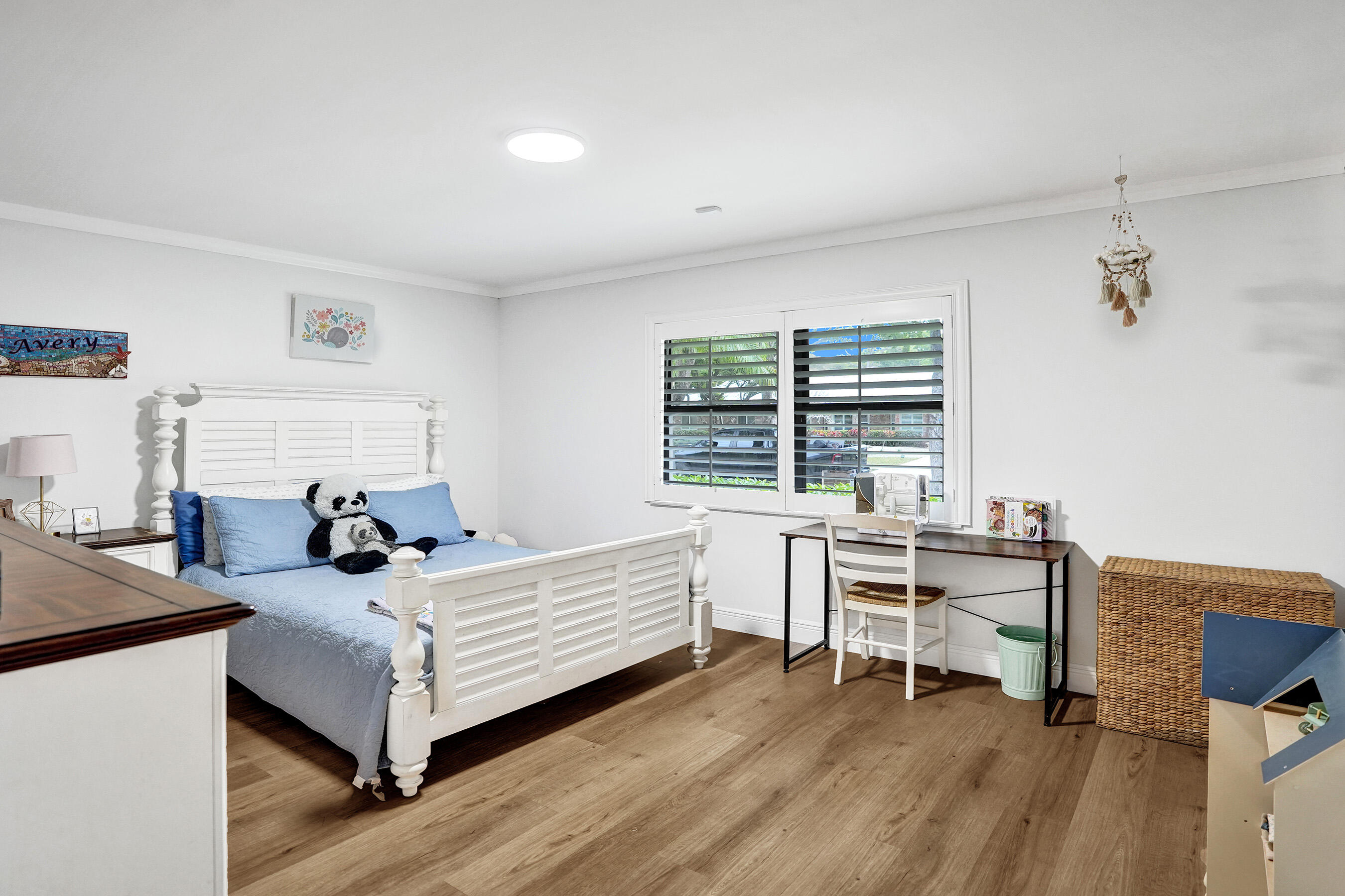 2413 Northwest 40th Circle Boca Raton, FL 33431 - Photo 32 of 66 a bedroom with a bed and a desk