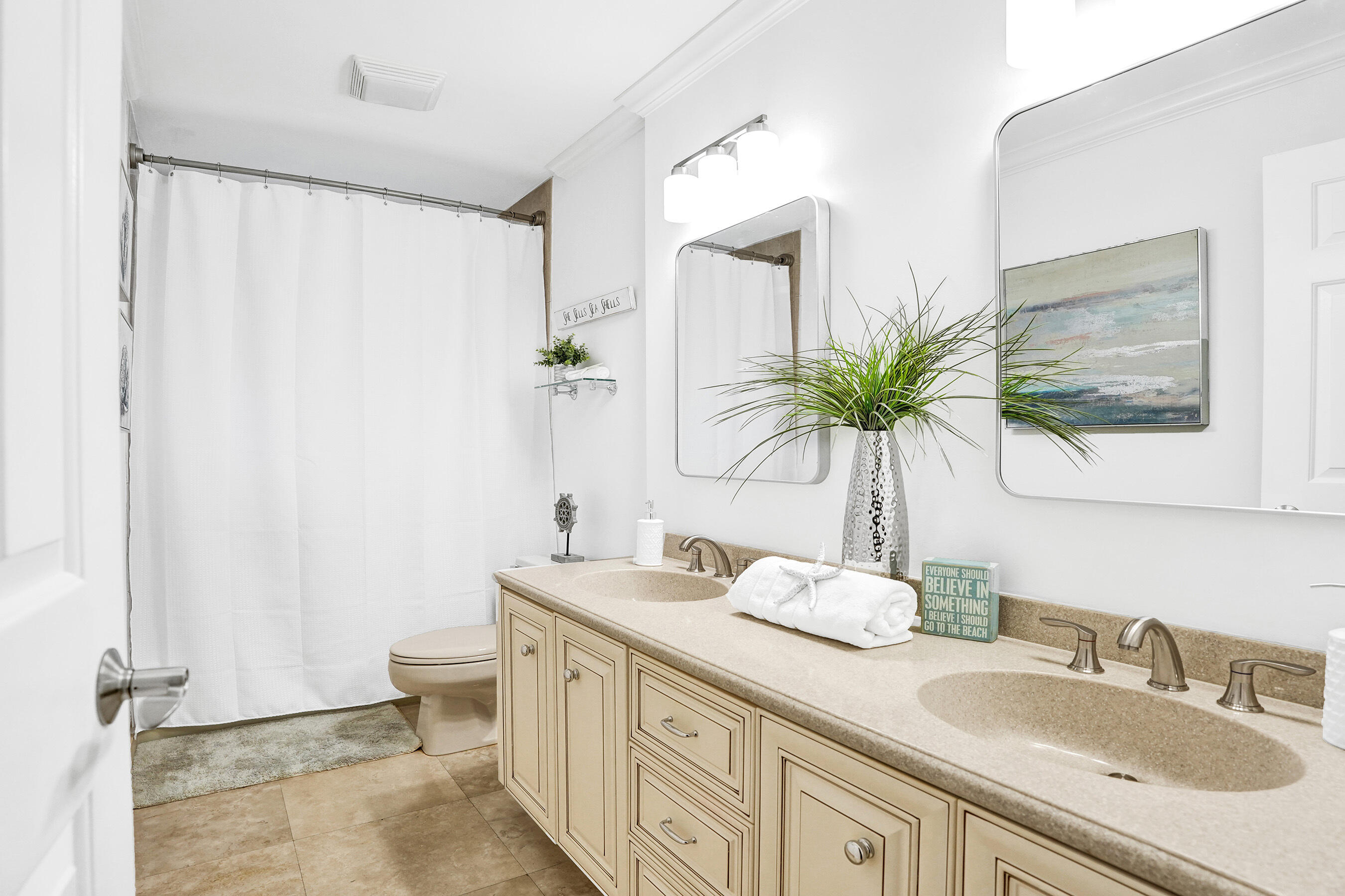 2413 Northwest 40th Circle Boca Raton, FL 33431 - Photo 37 of 66 a bathroom with a granite countertop sink a toilet and a mirror