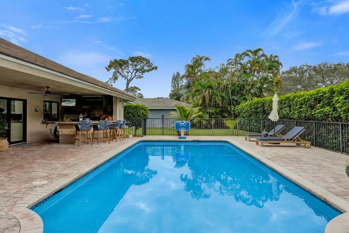 2413 Northwest 40th Circle Boca Raton, FL 33431 - Photo 39 of 66 a view of a swimming pool with chairs