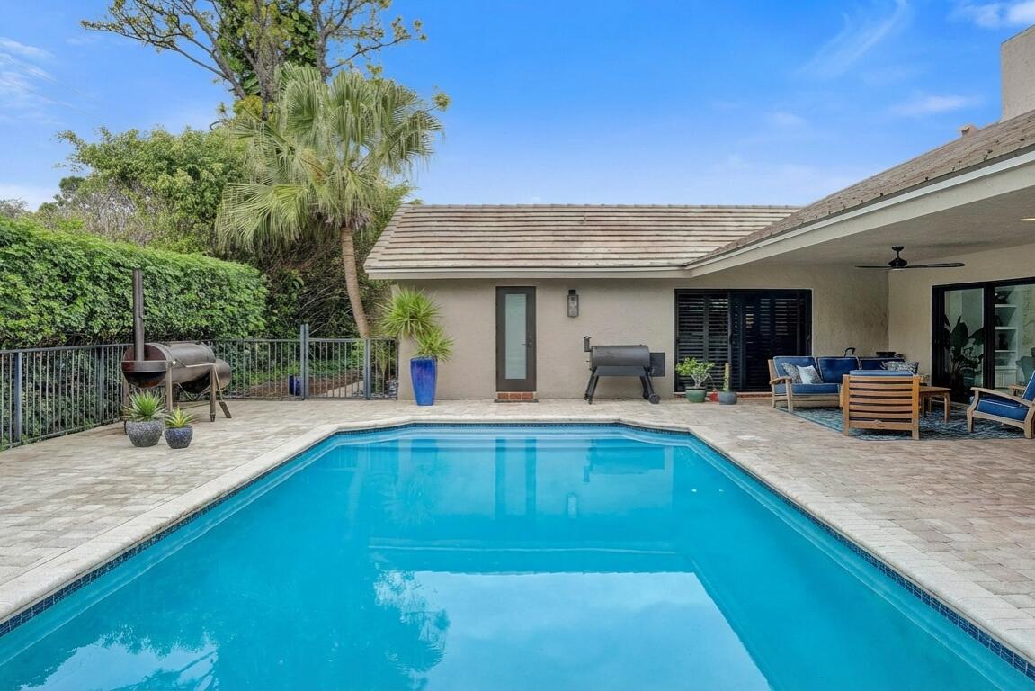 2413 Northwest 40th Circle Boca Raton, FL 33431 - Photo 43 of 66 a view of a backyard with a tub and chairs