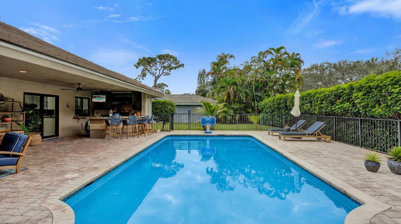 2413 Northwest 40th Circle Boca Raton, FL 33431 - Photo 44 of 66 a view of a backyard with swimming pool