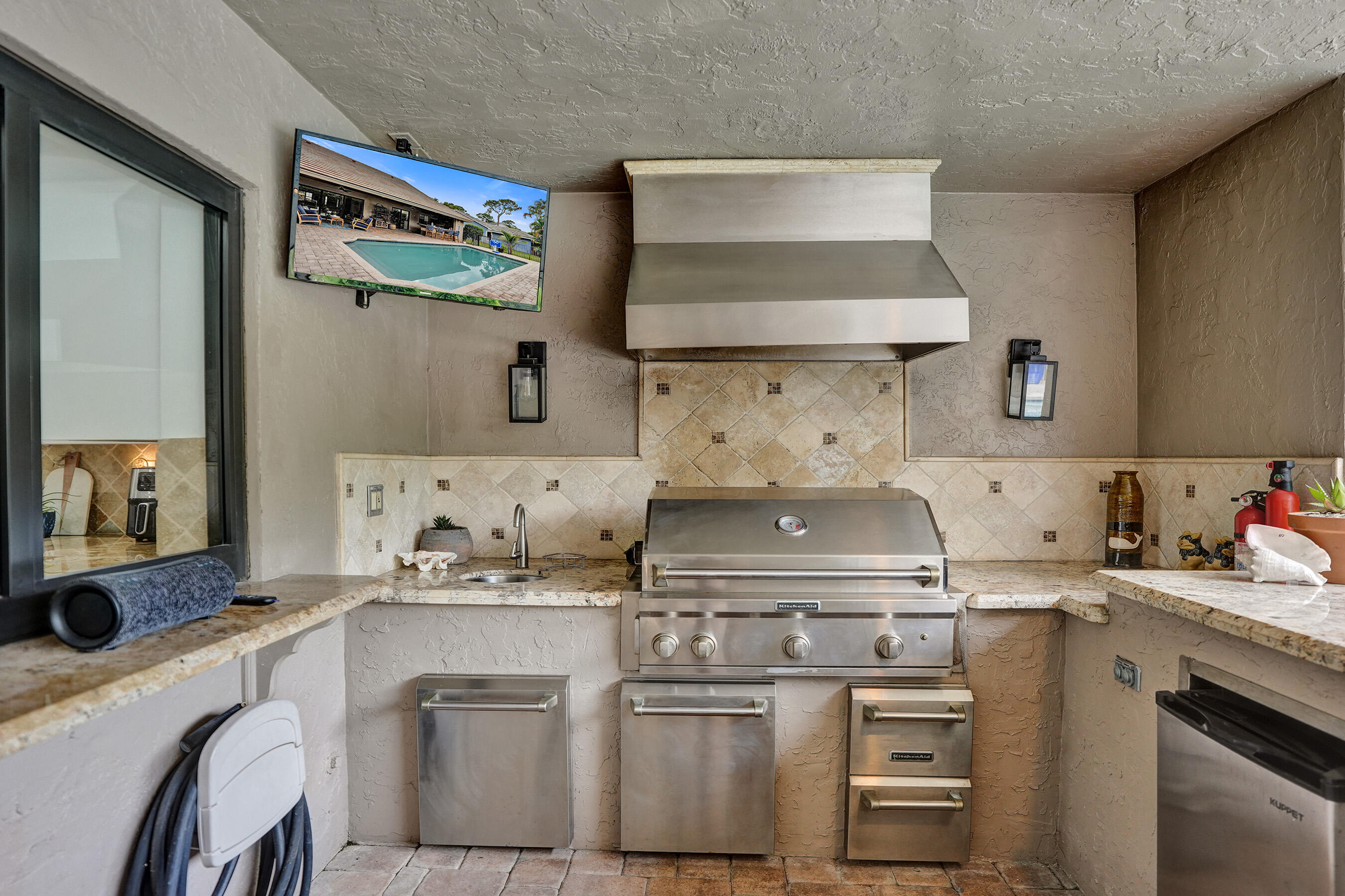 2413 Northwest 40th Circle Boca Raton, FL 33431 - Photo 49 of 66 a kitchen with appliances cabinets and a counter top space