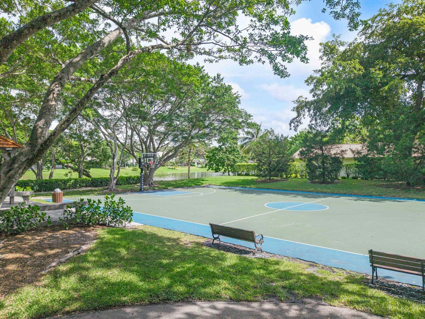 2413 Northwest 40th Circle Boca Raton, FL 33431 - Photo 60 of 66 a park view with a bench and trees