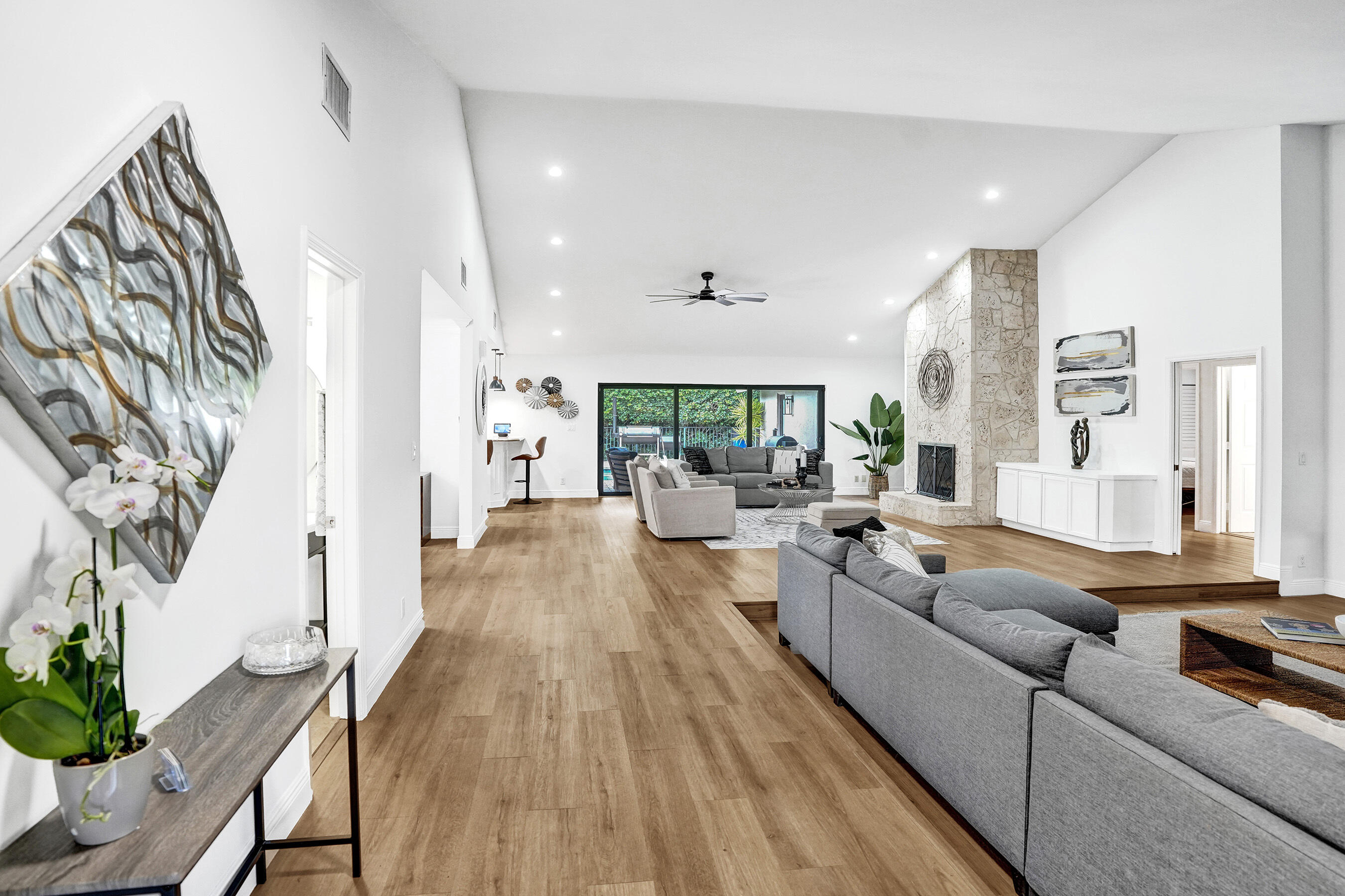 2413 Northwest 40th Circle Boca Raton, FL 33431 - Photo 6 of 66 a living room with furniture and a wooden floor