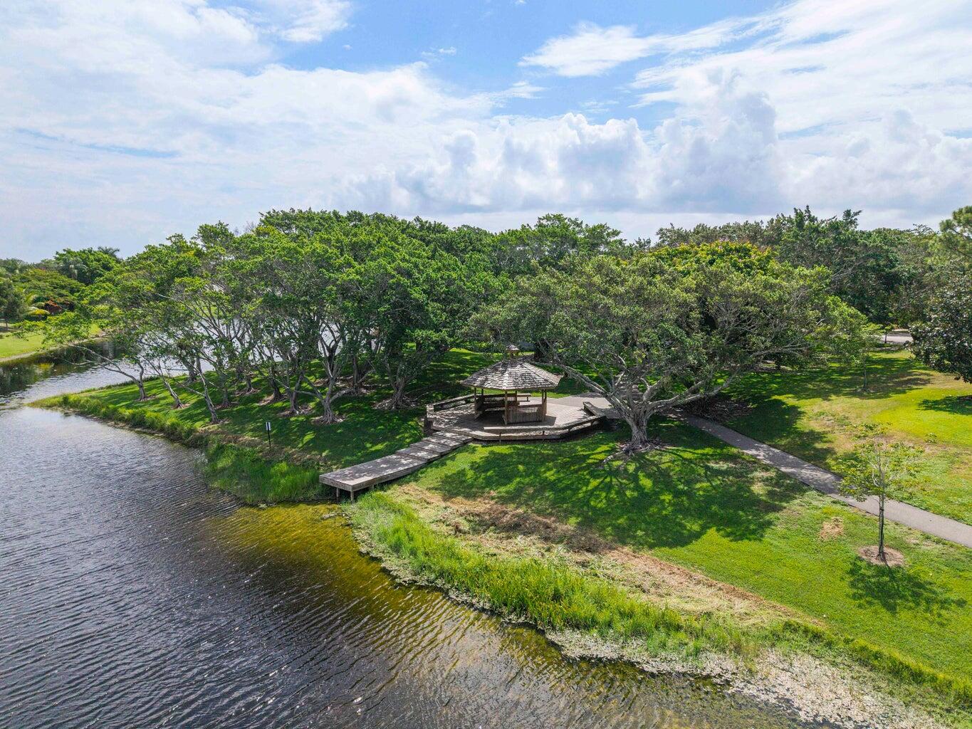 2413 Northwest 40th Circle Boca Raton, FL 33431 - Photo 62 of 66 a backyard of a house with lots of green space