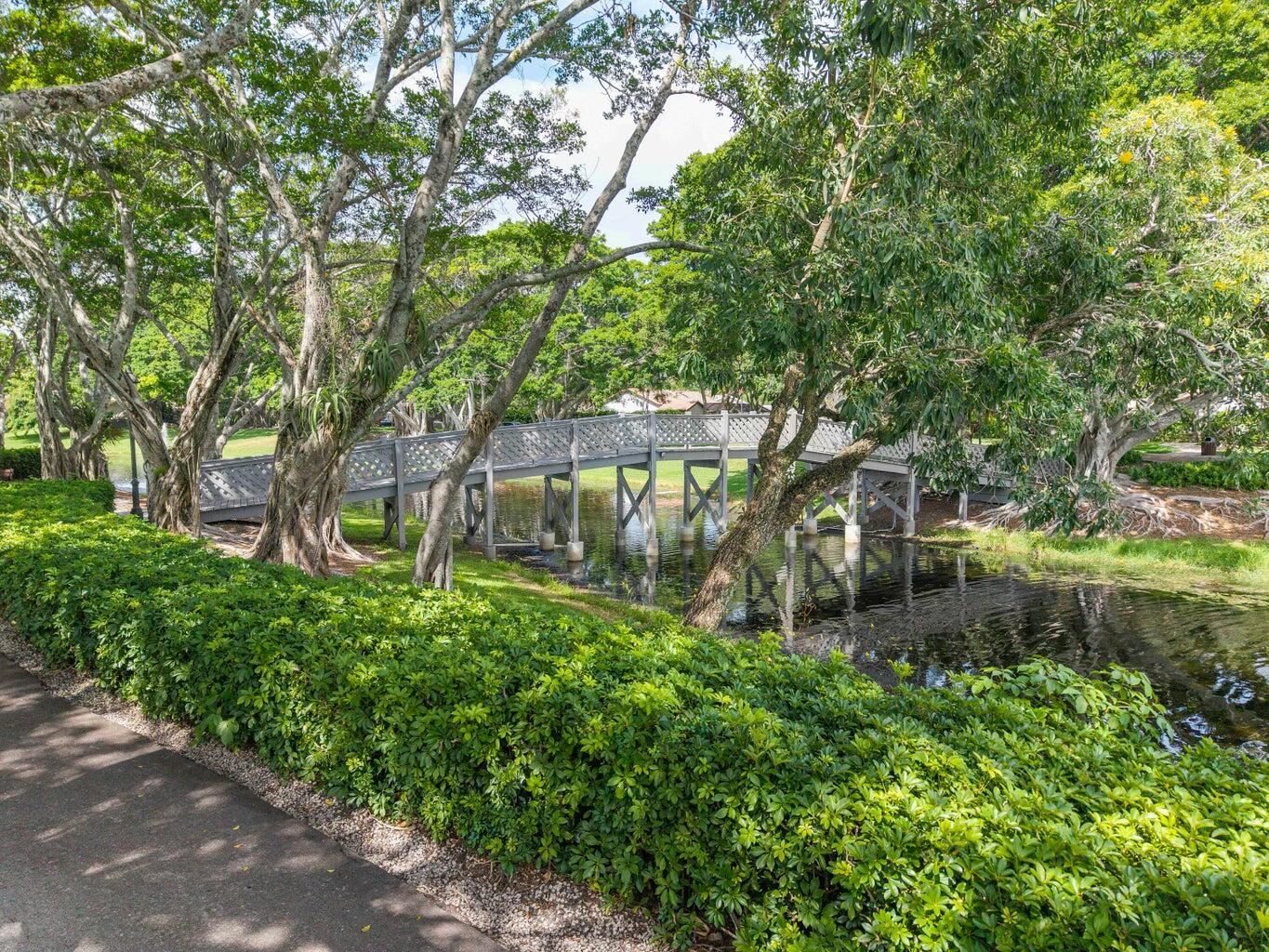 2413 Northwest 40th Circle Boca Raton, FL 33431 - Photo 63 of 66 a backyard of a house with lots of green space