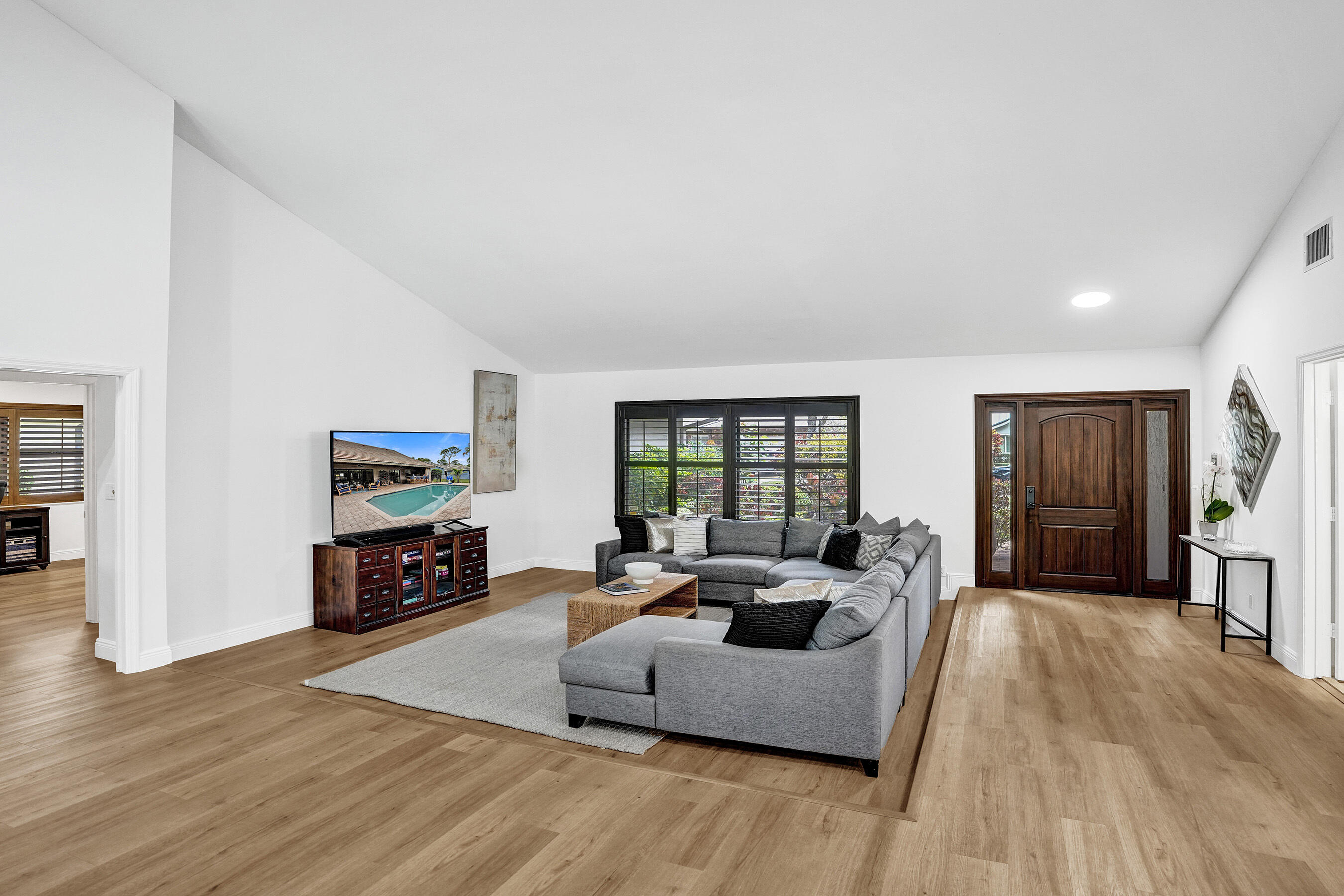 2413 Northwest 40th Circle Boca Raton, FL 33431 - Photo 10 of 66 a living room with furniture and a fireplace