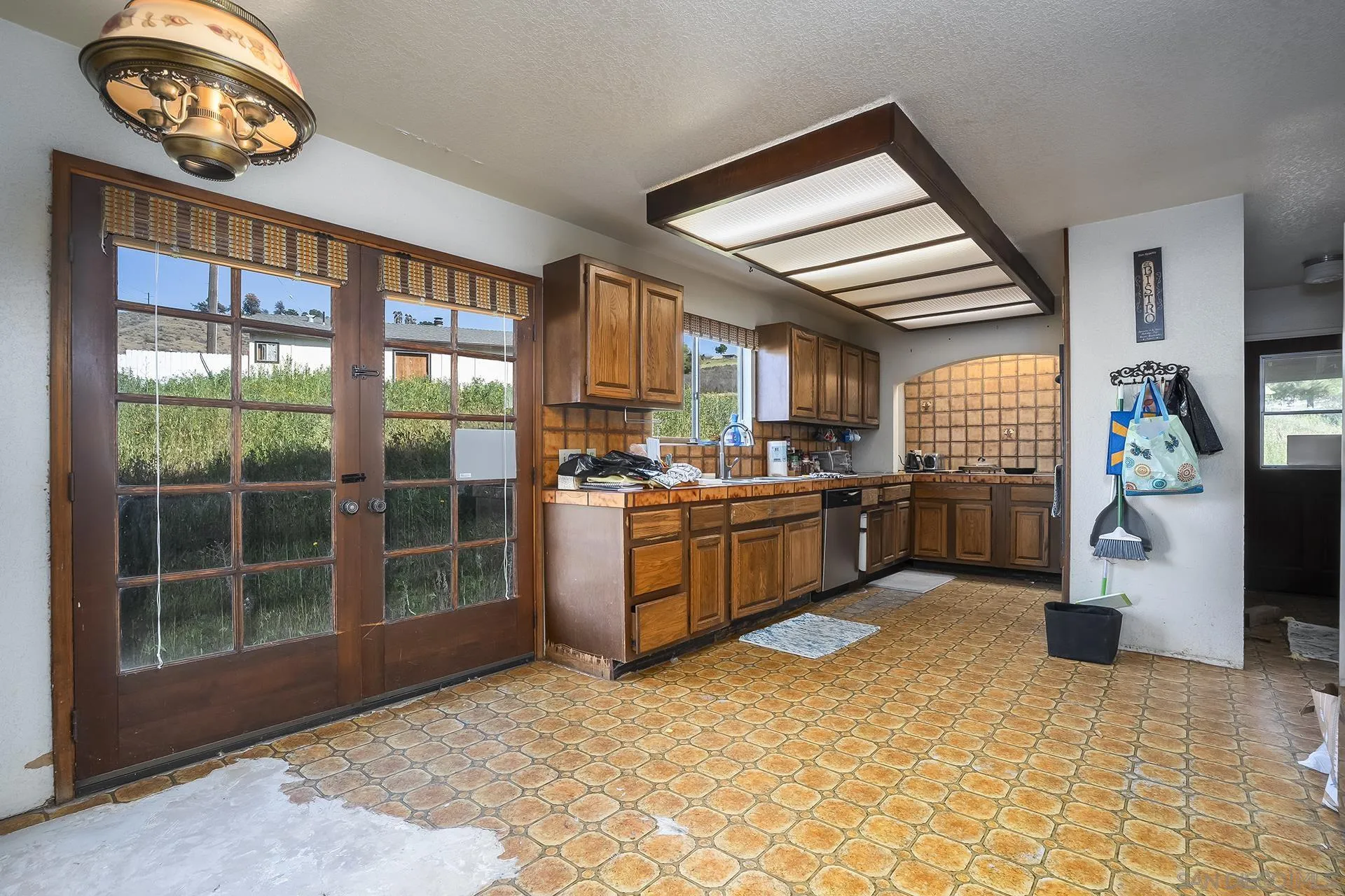 4829 Dehesa Road El Cajon, CA 92019 - Photo 3 of 14 a view of a kitchen with furniture and window