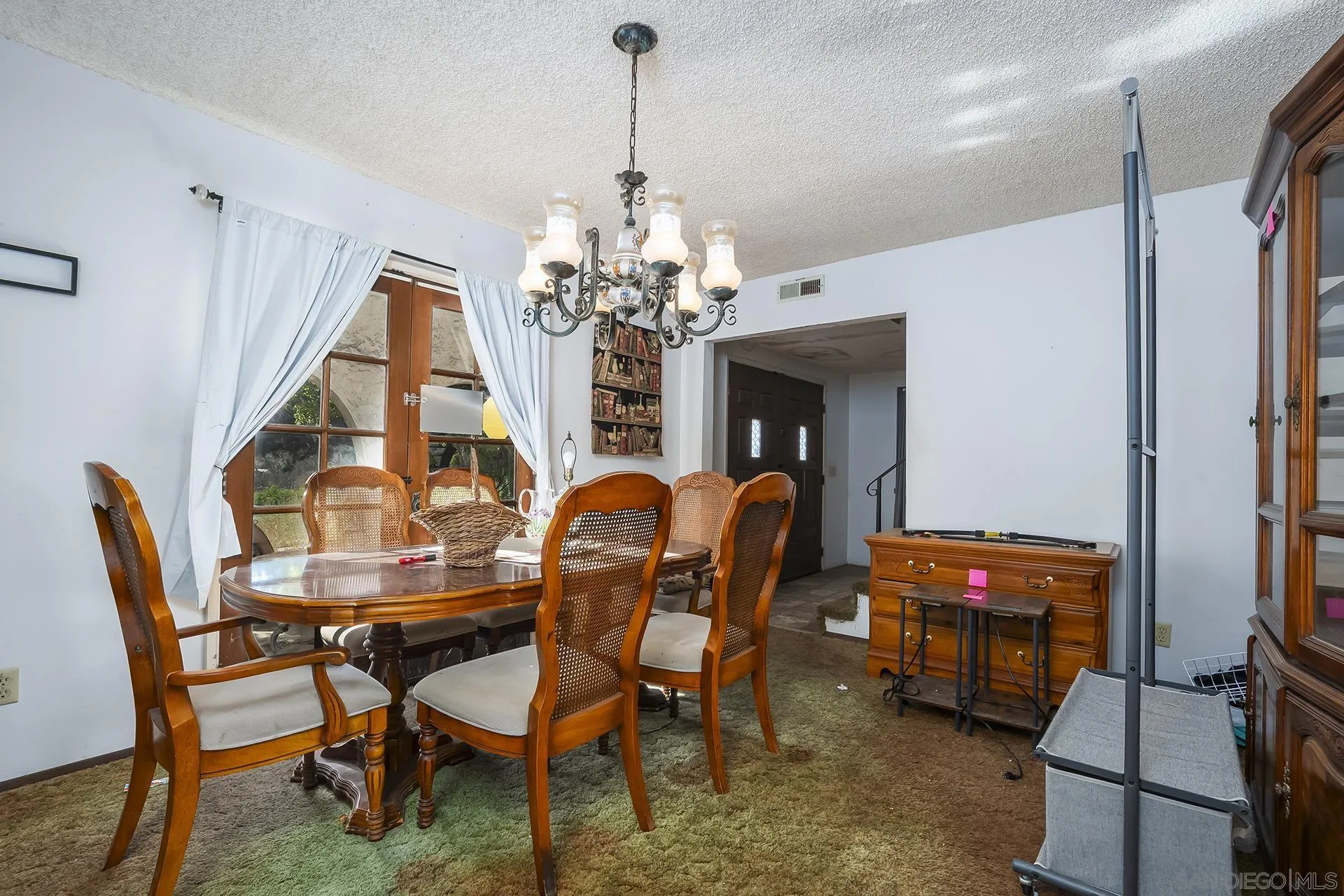 4829 Dehesa Road El Cajon, CA 92019 - Photo 5 of 14 a view of a dining room with furniture and chandelier