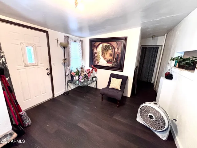 a view of living room with furniture and a window