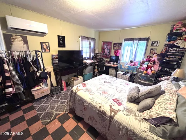 a living room with rug toys and a large window