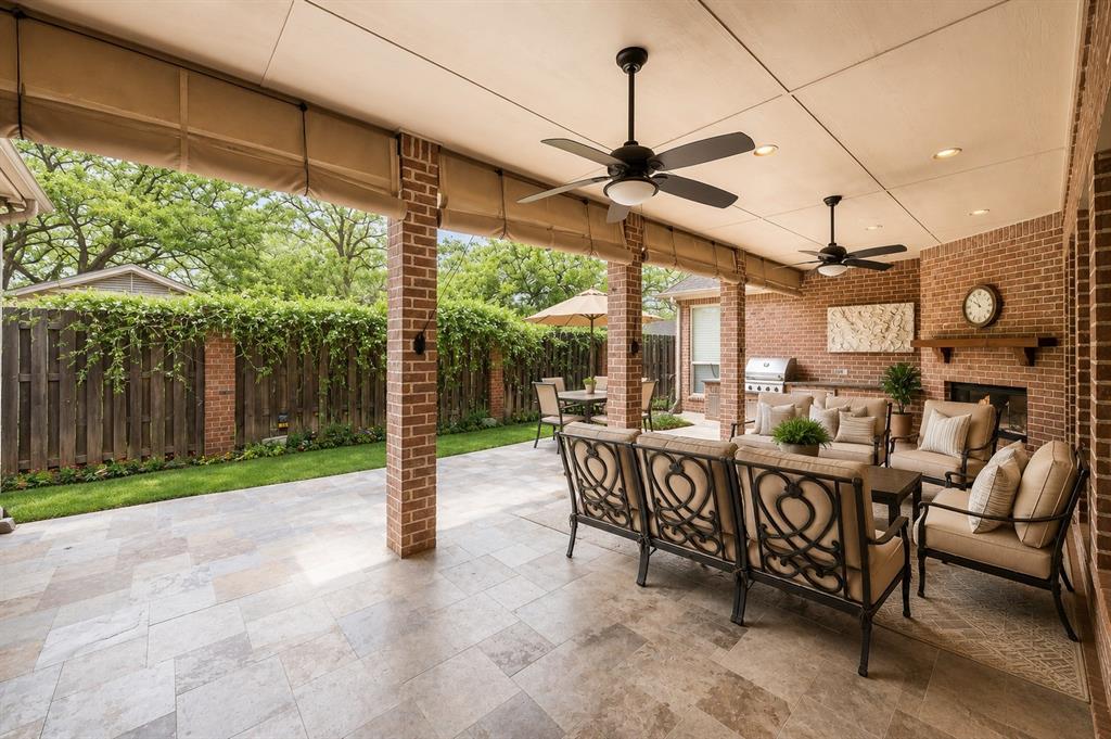2726 Country Club Road Pantego, TX 76013 - Photo 21 of 23 a view of a patio with a table chairs and a backyard